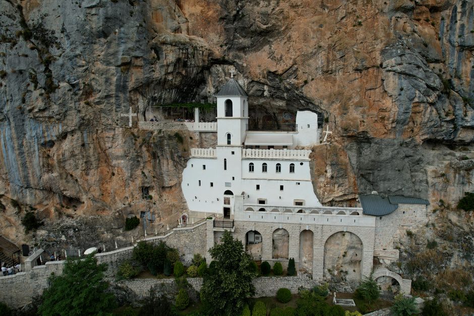 The upper monastery church built directly into the rock face of Ostroška Greda