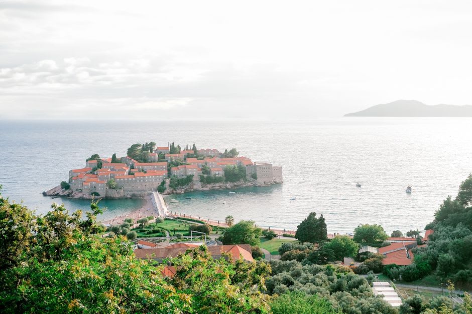 Fishermen's stone houses with terracotta roofs on the Sveti Stefan islet