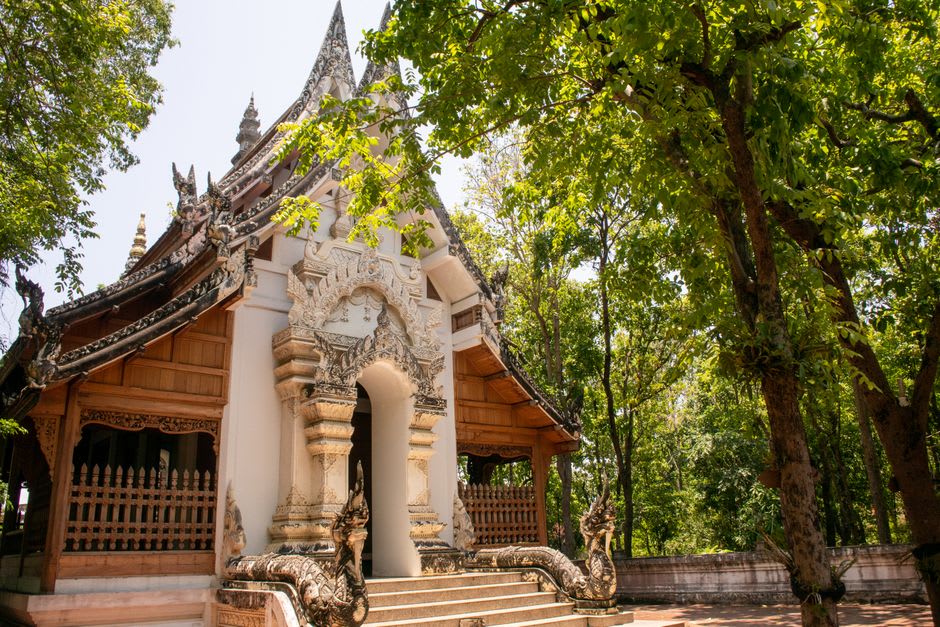 A traditional Sumi Naga morung structure with carved wooden beams near Zunheboto