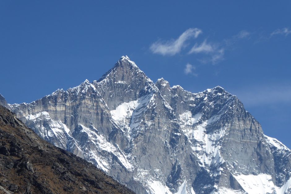 Stone-walled fields and scattered teahouses in the high valley village of Dingboche