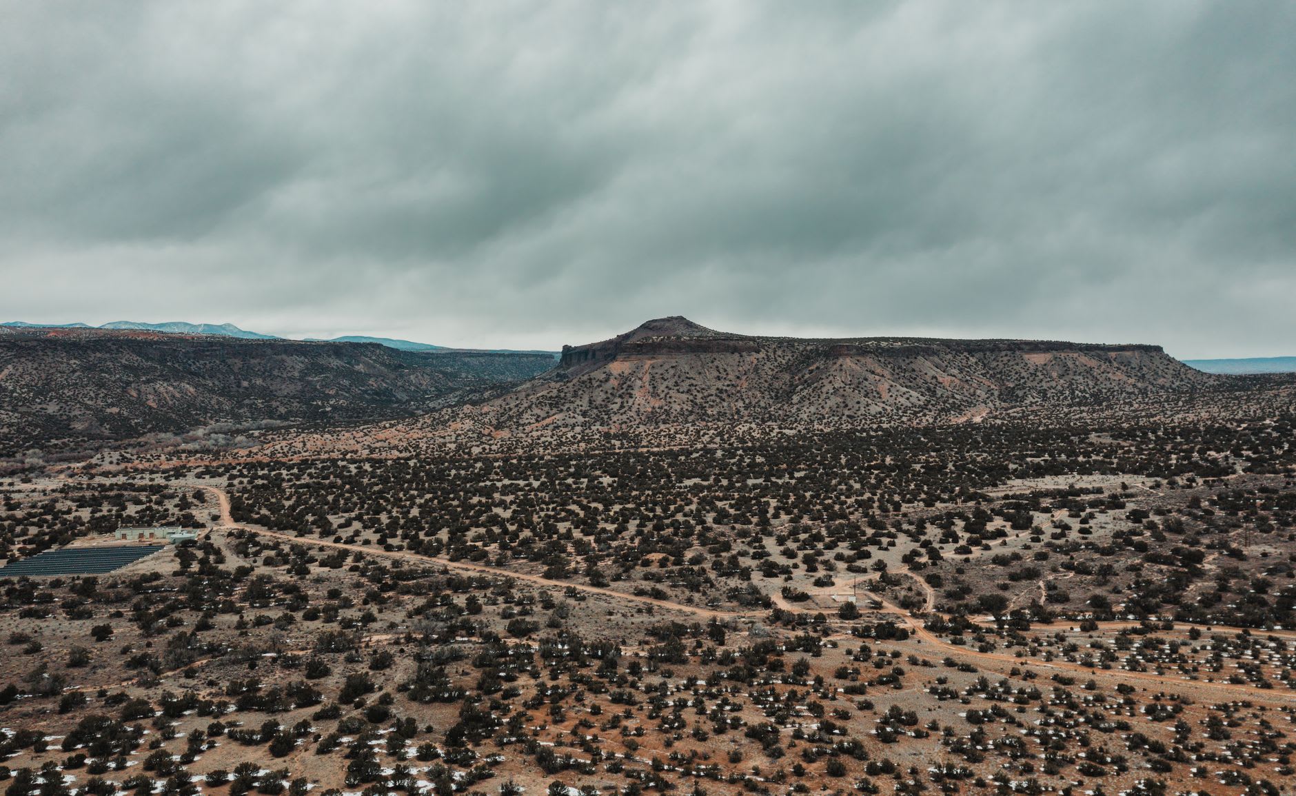 The red and ochre cliffs above the Chama River valley near Abiquiú, with the characteristic layered geology