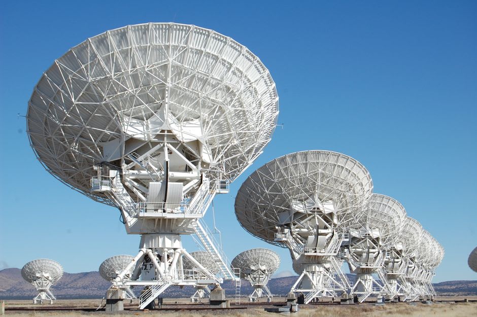The VLA antennas catching golden late-afternoon light on the remote high desert basin