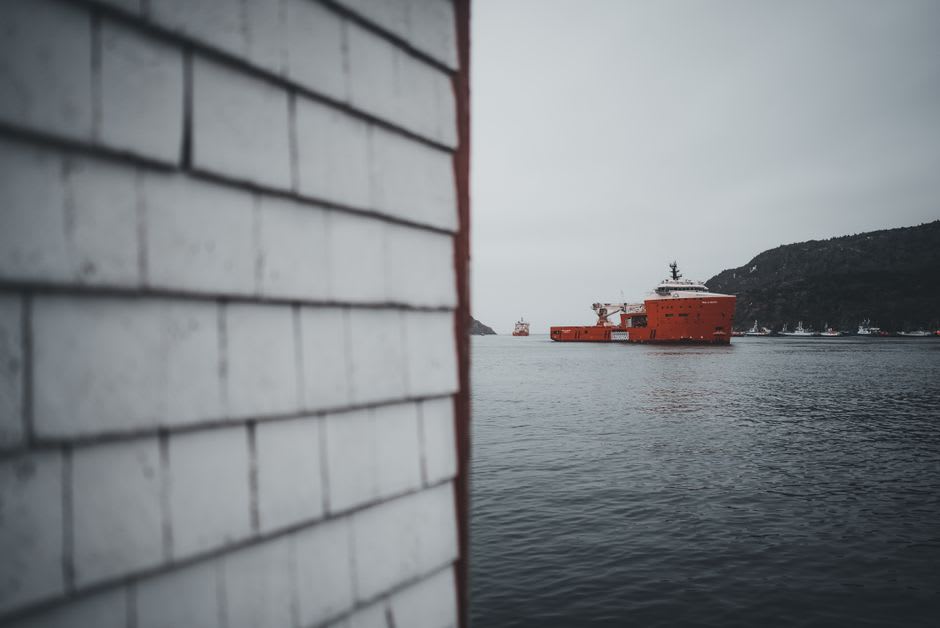 Fishing boat crossing the Bay of Islands near Corner Brook at dusk