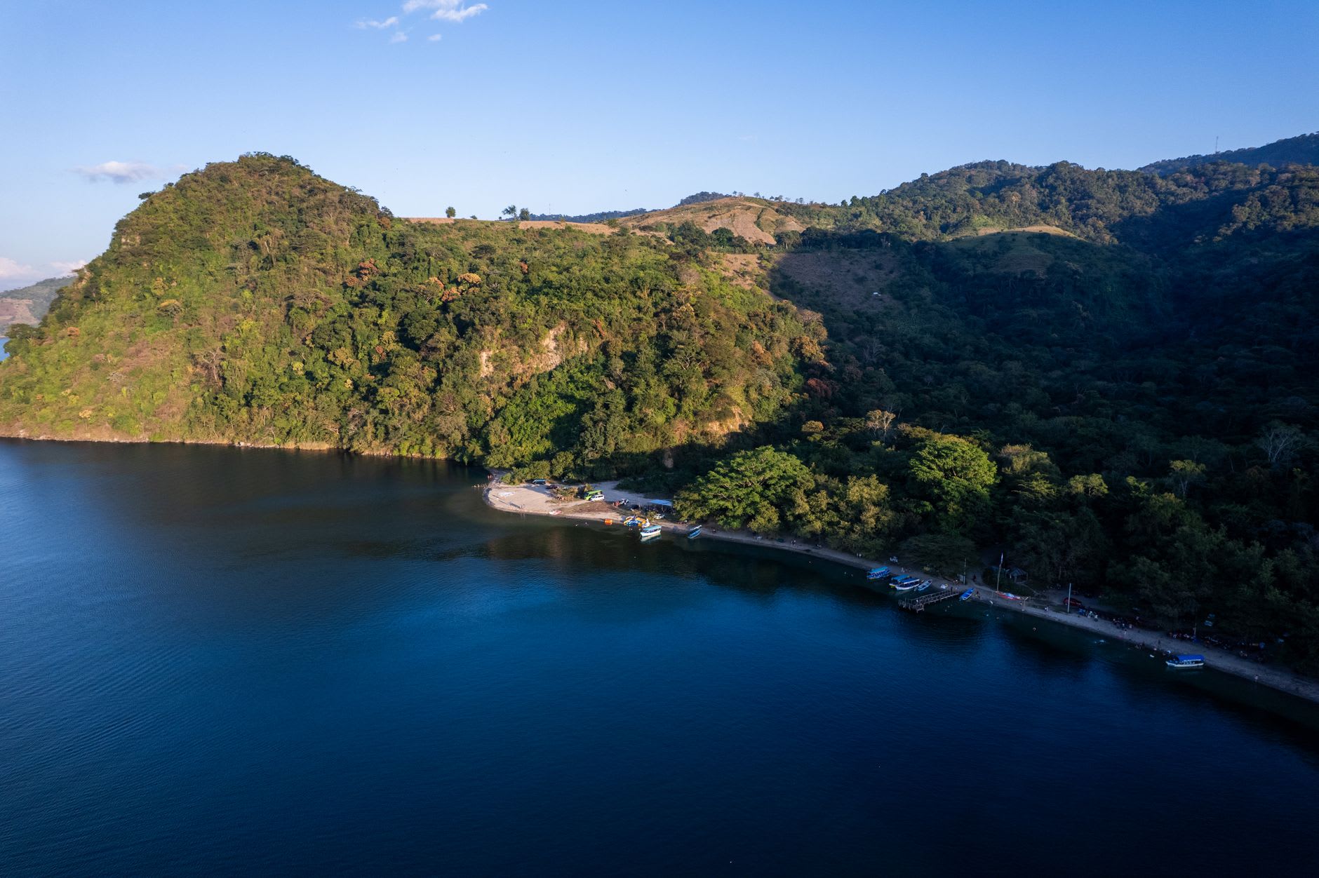 The crater lake viewed from the Catarina lookout at golden hour with the volcano Mombacho in the distance
