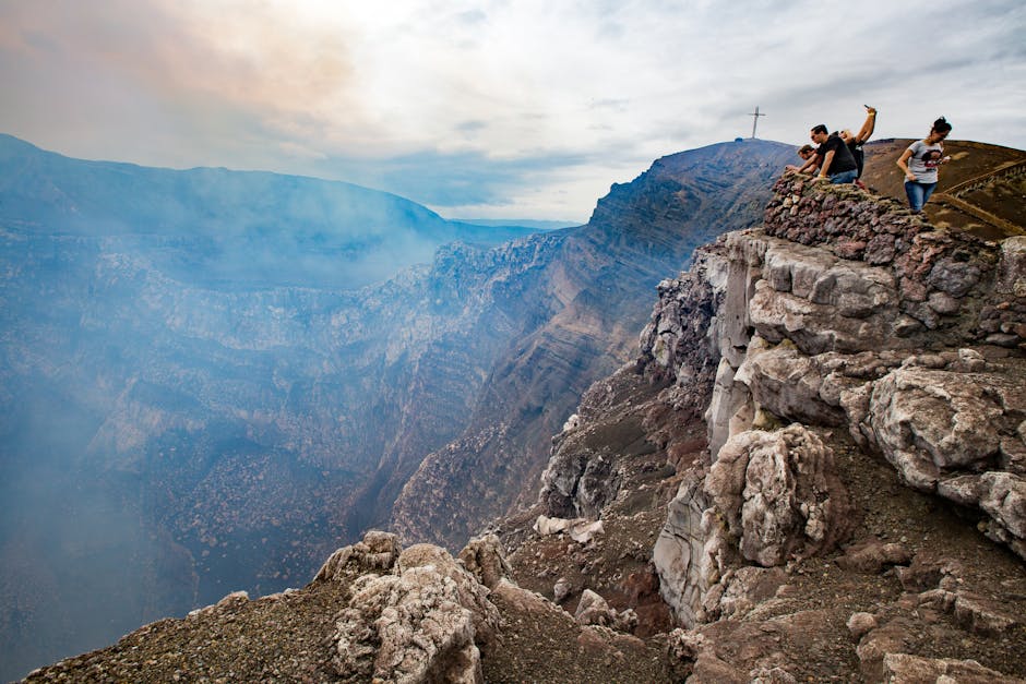 Masaya Volcano crater with volcanic smoke rising