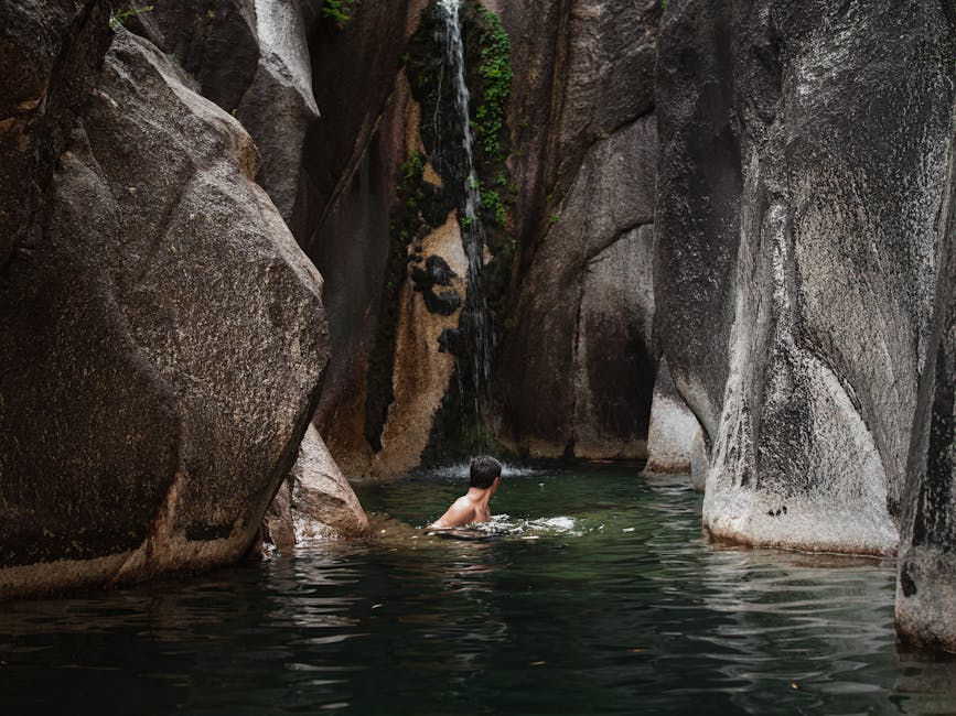 Tropical river canyon with lush vegetation and rock formations