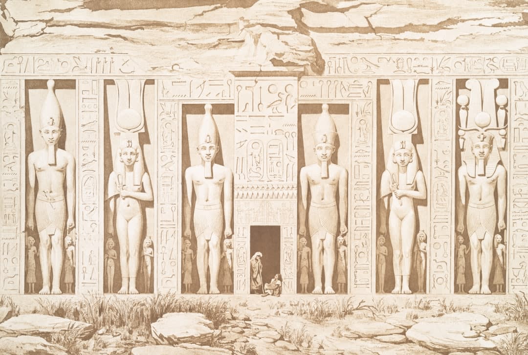 Painted hieroglyphs and figures on the tomb wall in the Valley of the Queens