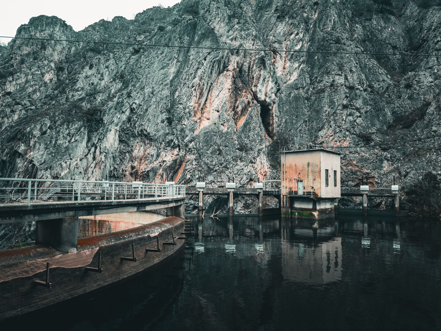 The tiny frescoed chapel of the Monastery of Saint Andrew hewn into the limestone cliff above the waters of Matka Canyon
