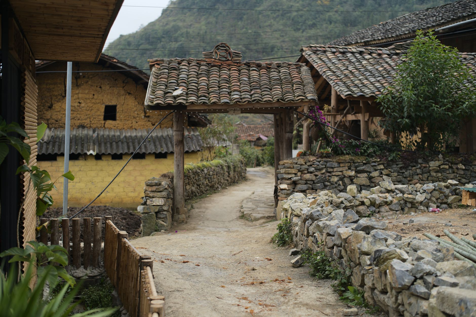 Misty morning over the Tam Sơn valley with the two rounded hills of Núi Đôi below, Quản Bạ, Vietnam