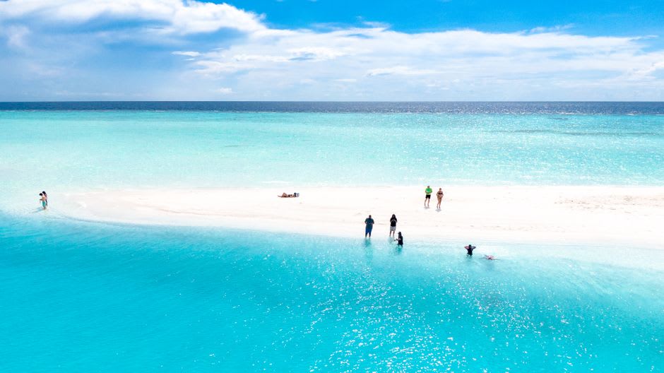 The white sandbar of Hatenohama with turquoise water on both sides, Kume Island