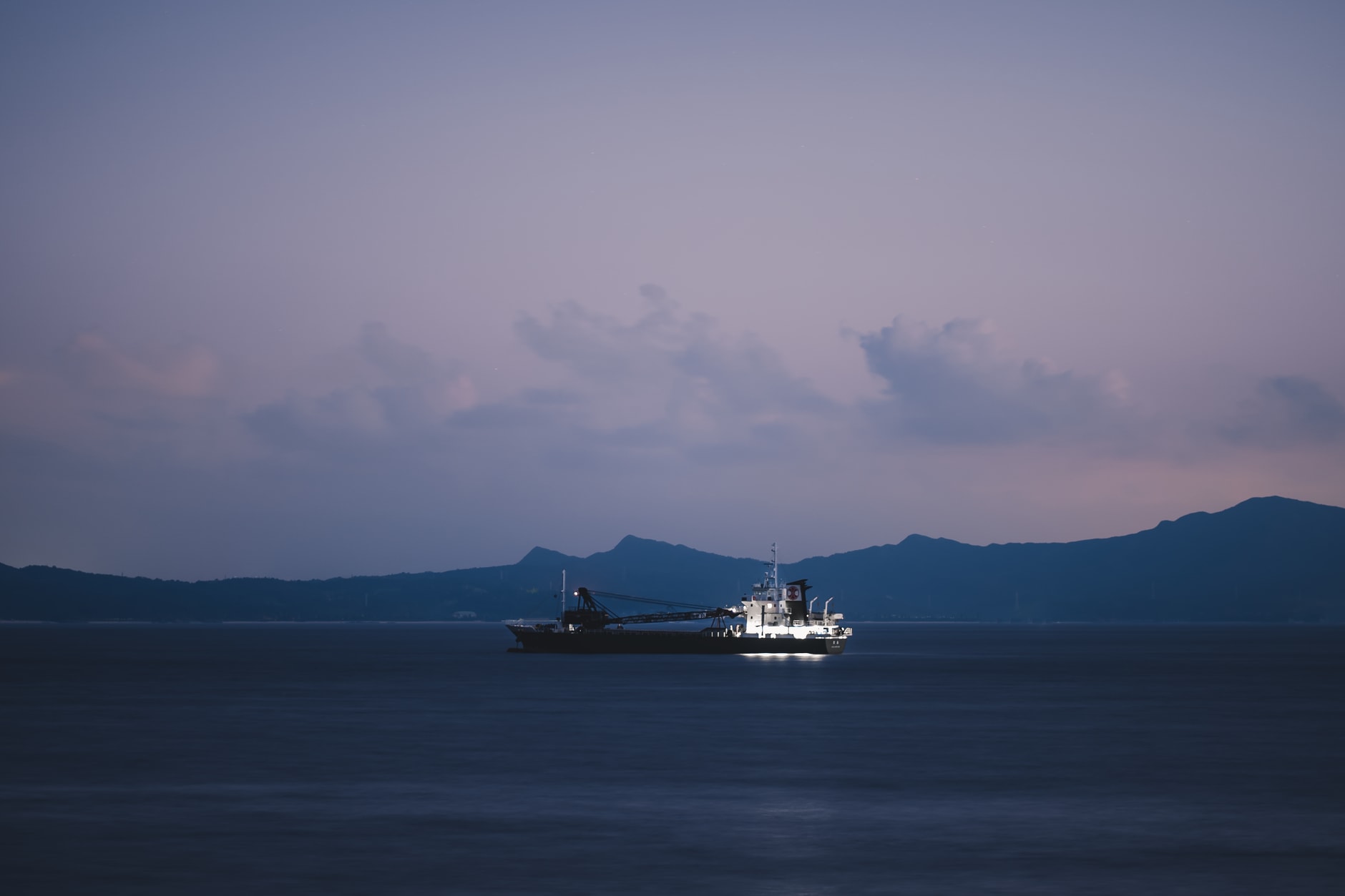 The harbour at dusk, Zamami Island, fishing boats at anchor, the sky turning orange and rose