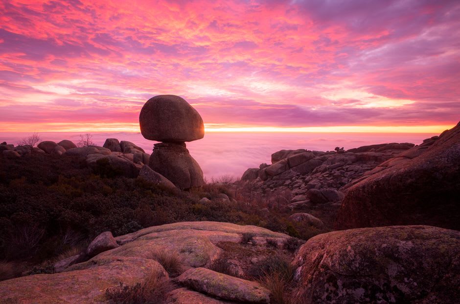 Massive round granite boulders of Karlu Karlu glowing deep red-orange in late afternoon light