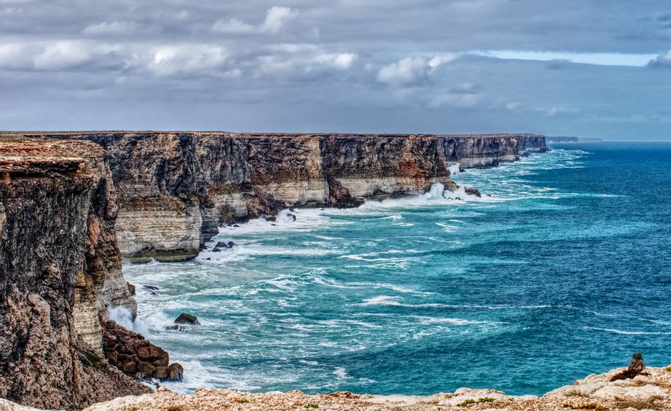 The sheer white Bunda Cliffs of the Nullarbor dropping into the deep blue water of the Great Australian Bight