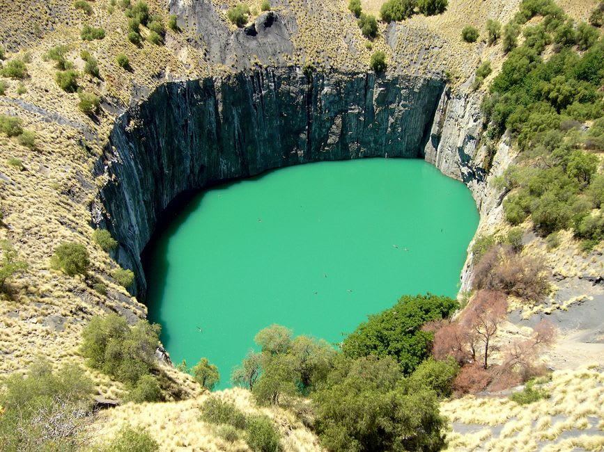 Ellery Creek Big Hole, a deep spring-fed waterhole shaded by tall red rock walls