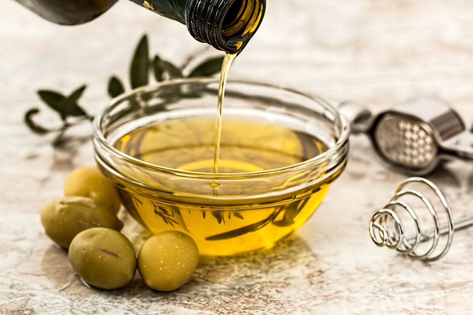 Freshly pressed green olive oil running from a traditional press during the autumn harvest near Birzeit