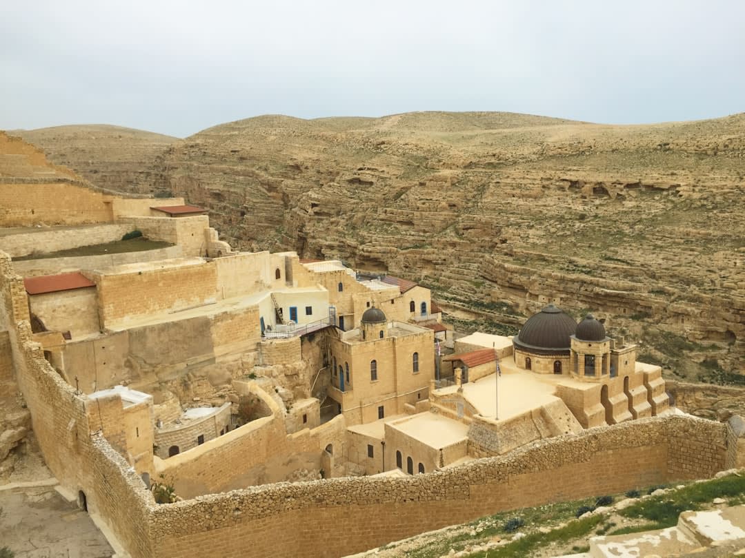 Mar Saba's domed rooftops and terraces built directly into the cliff face of the Kidron Valley