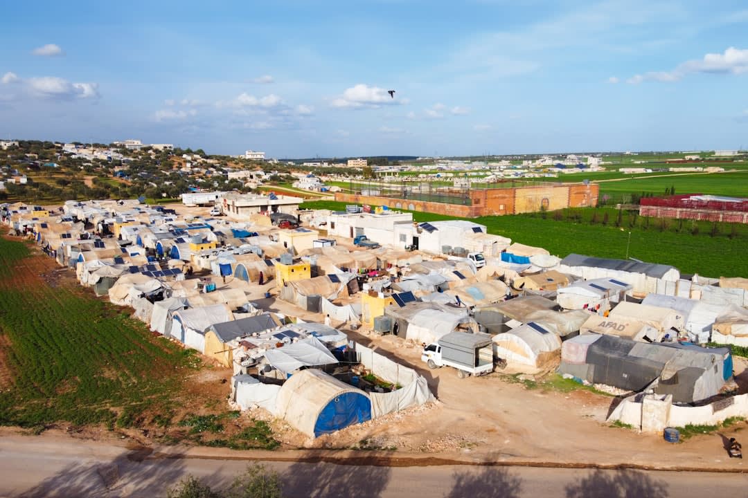 Mural depicting an ancestral village painted on a wall in Tulkarm refugee camp