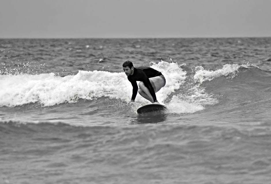 A surfer riding a long right-hand wave at the Santa Catalina point break, Pacific Panama
