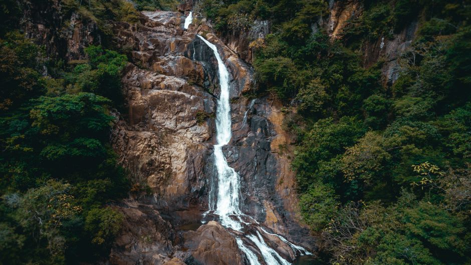 A clear waterfall cascading through untouched forest near Santa Fe de Veraguas, no other visitors in sight