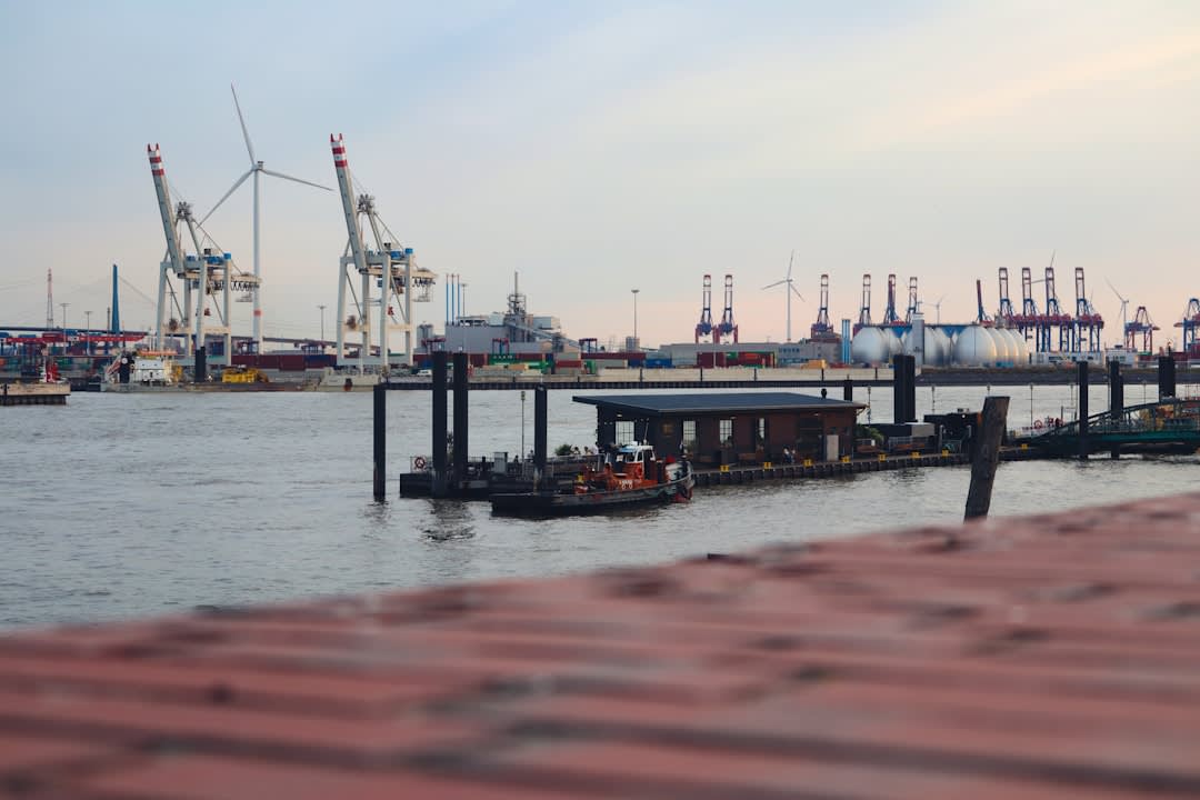 Cargo boats loading at the riverside port of Concepcion on the Paraguay River, weathered wooden docks in the foreground