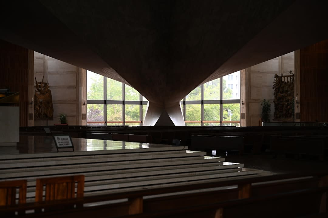 The interior of the roofless nave at Jesus de Tavarangue, sunlight falling on grass growing where a congregation once would have stood