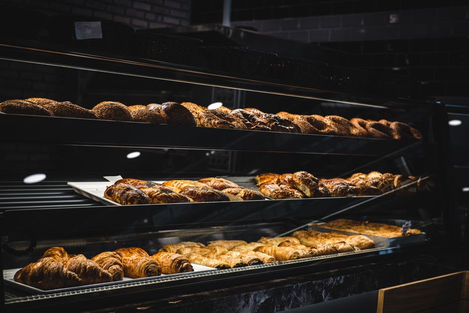 A bakery counter in Loma Plata displaying traditional Mennonite pastries alongside Paraguayan chipa