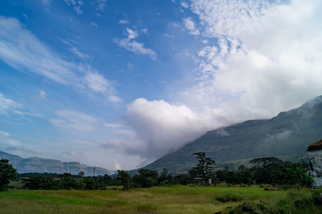 Green hills of the Cordillera de los Altos surrounding Piribebuy under an overcast sky