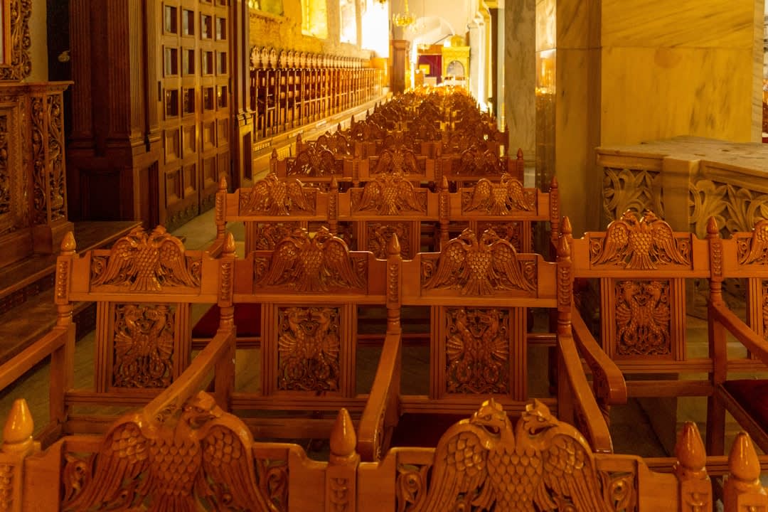The gold-leafed carved wooden altarpiece inside the Franciscan church of Yaguaron, intricate floral and angel motifs covering the surface