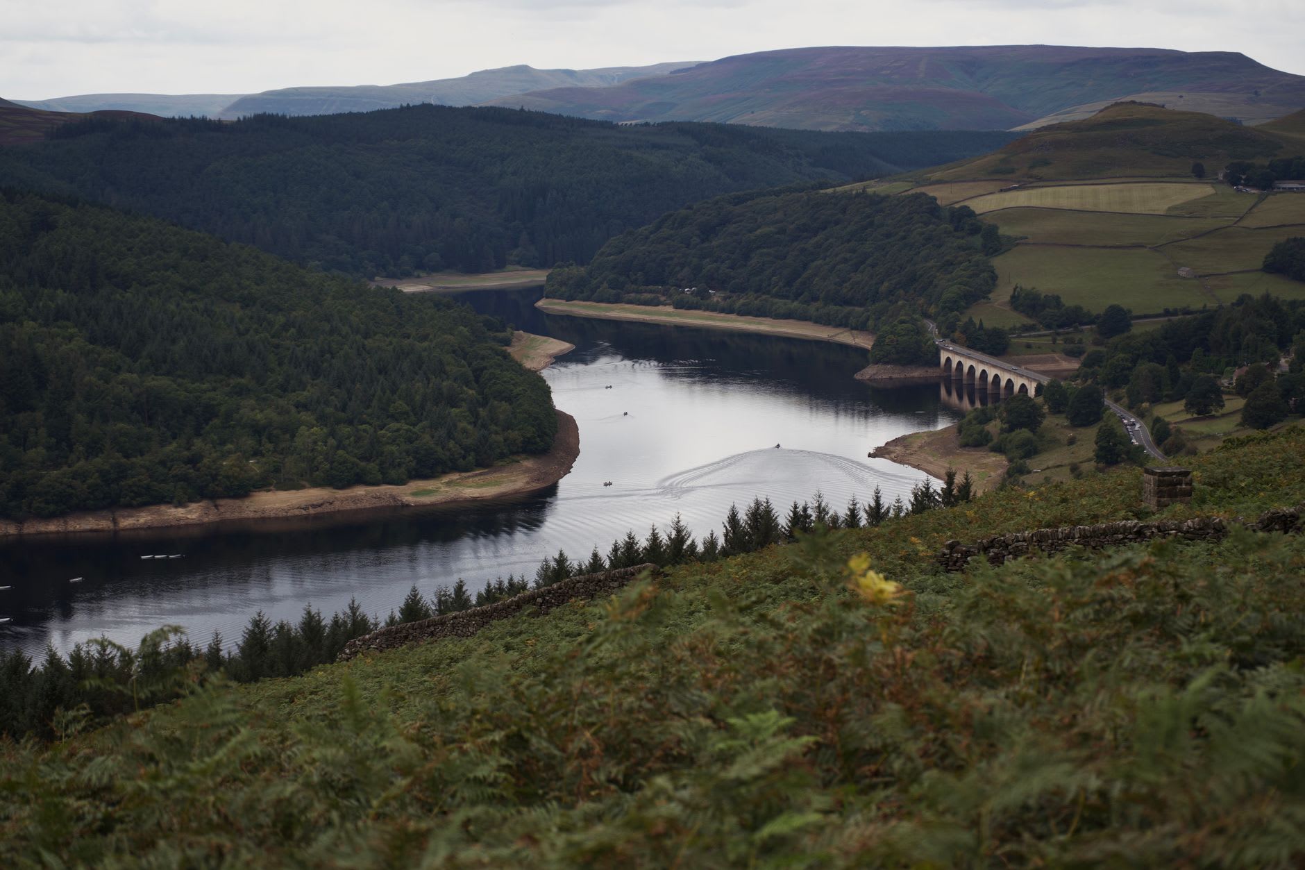 The Derwent Dam at the north end of the reservoir, its twin towers in Victorian Gothic, with the reservoir full to the spillway in October