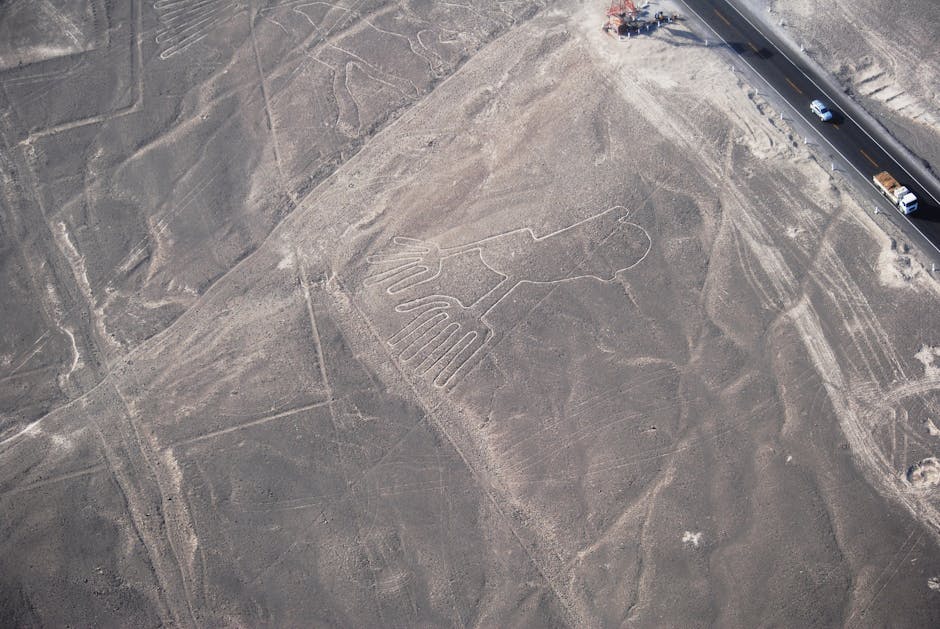 Aerial view of ancient desert geoglyphs etched into the barren plateau