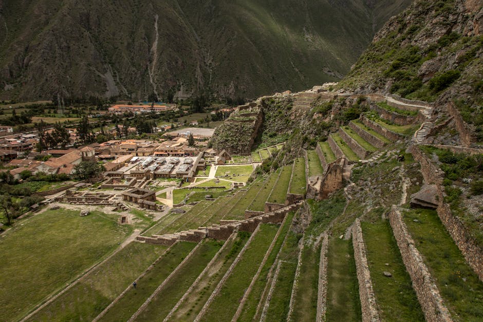 Maras salt terraces cascading down a mountainside in geometric white pools