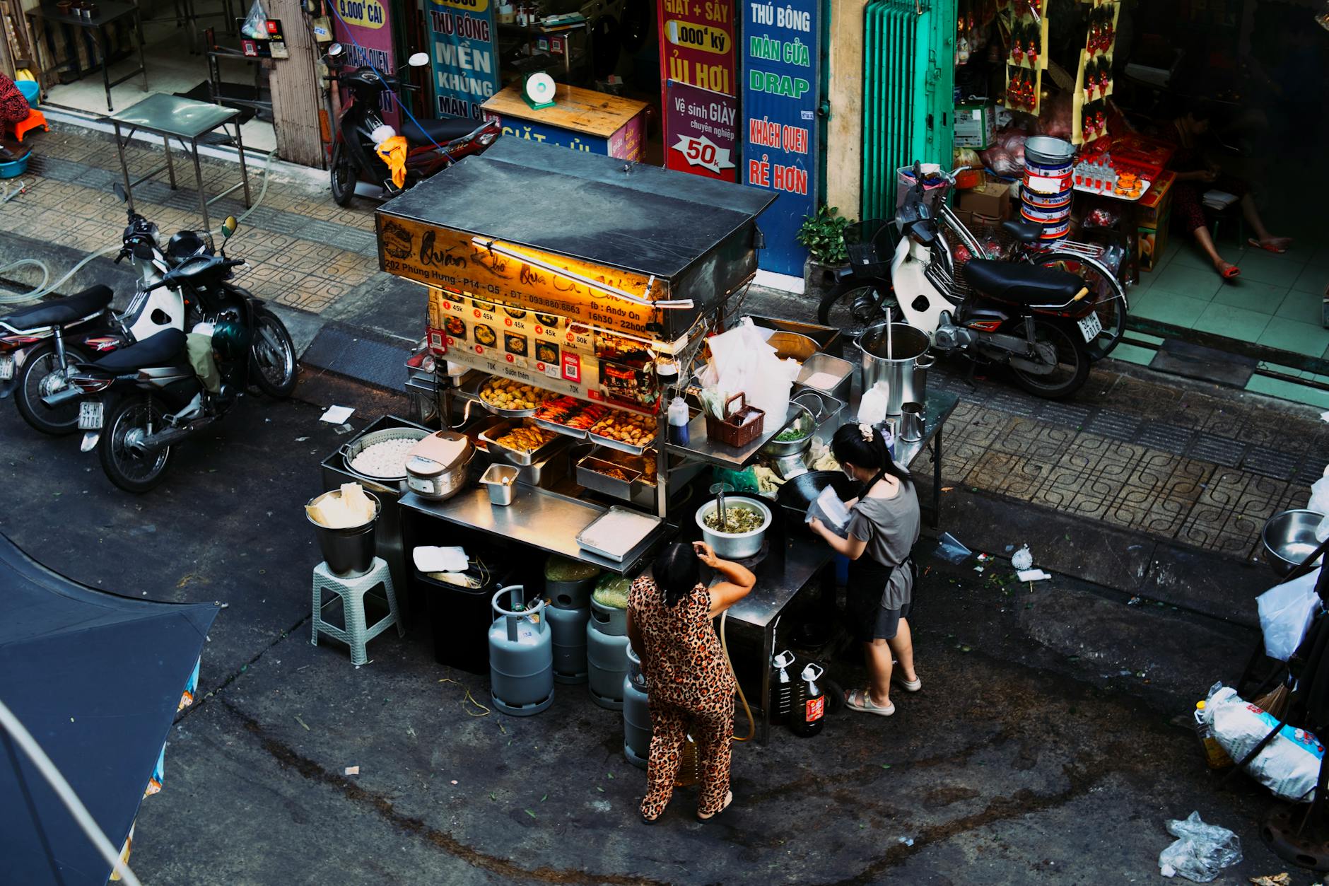 Street food vendors and neon signs in Manila's bustling Poblacion neighborhood