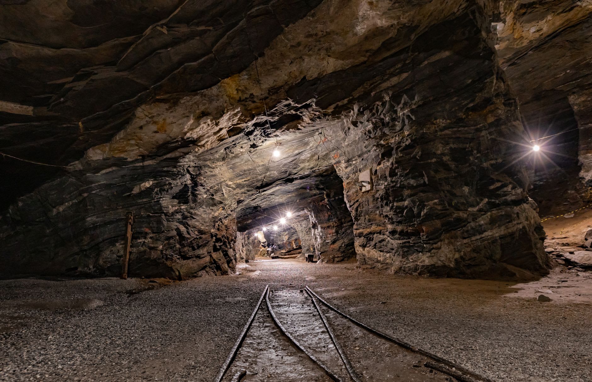 An underground saline lake reflecting the carved salt walls deep in the Wieliczka mine