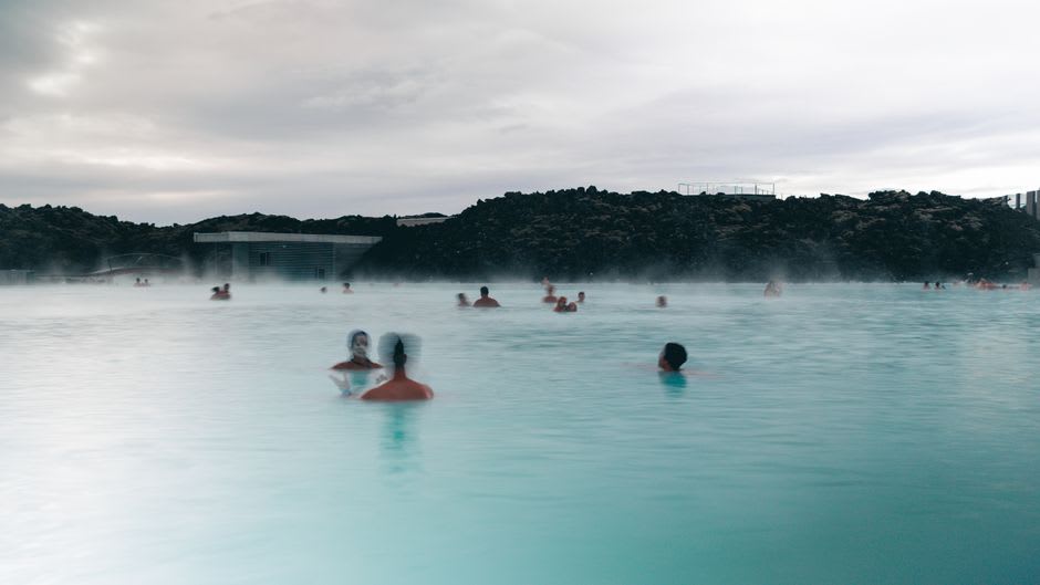 Steam rising off the natural thermal spring pools at Chaves with the old spa building in the background