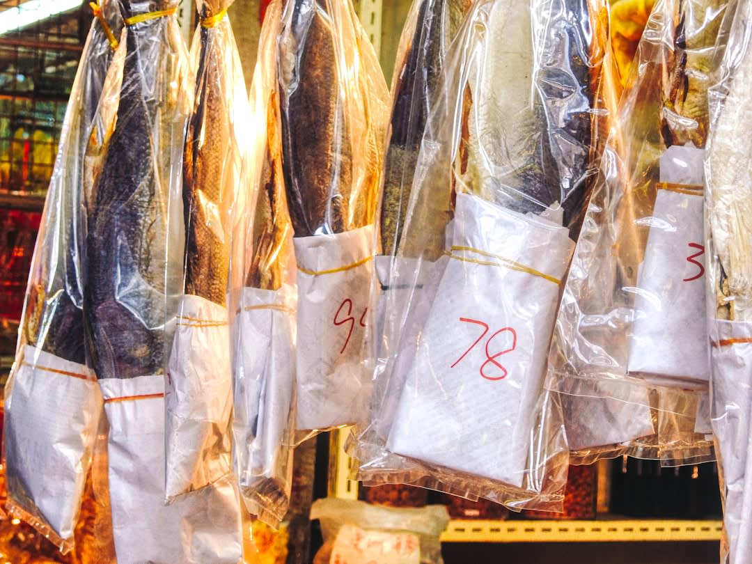 Cured hams and smoked sausages hanging in a traditional Trás-os-Montes charcuterie shop in Chaves