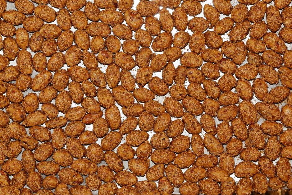 Copper pan of hand-coated sugared almonds being prepared in a small shop in Freixo de Espada à Cinta