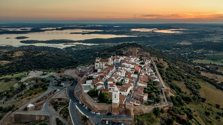 Lake Alqueva stretching to the horizon as seen from Monsaraz's hilltop castle walls at sunset