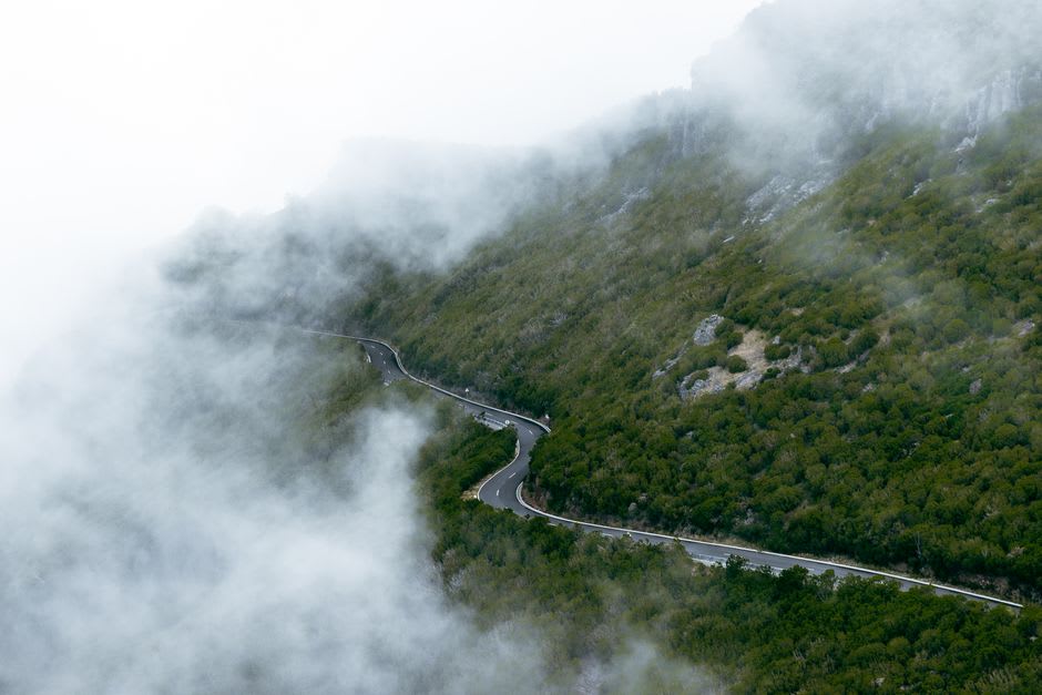Green hills and forest near Santana with clouds rolling in from the Atlantic over Madeira's north coast
