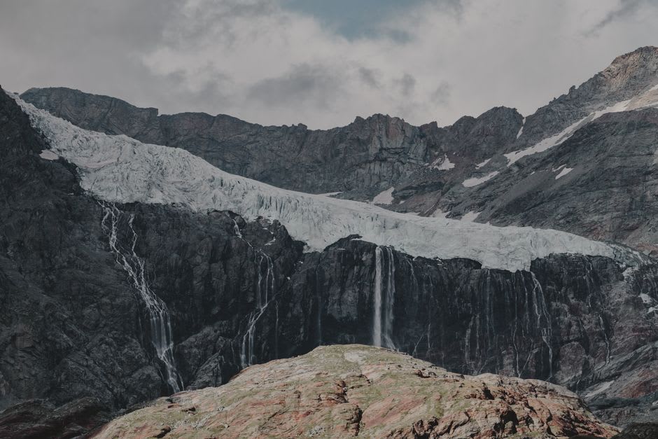 Dramatic U-shaped Zêzere glacial valley with waterfalls cascading down steep granite walls
