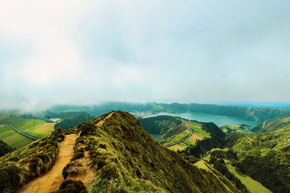 Foggy morning view over the twin crater lakes of Sete Cidades from the rim trail