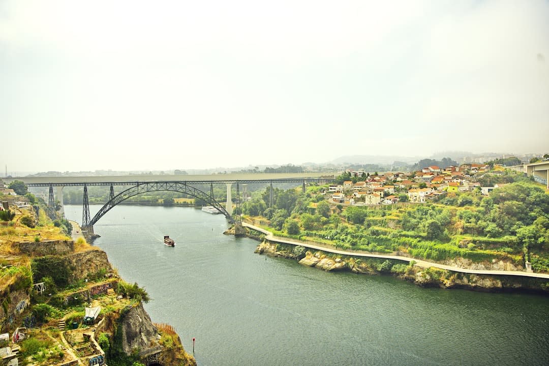 View over the deep river gorge below Vila Real's cliff-edge old town at dusk