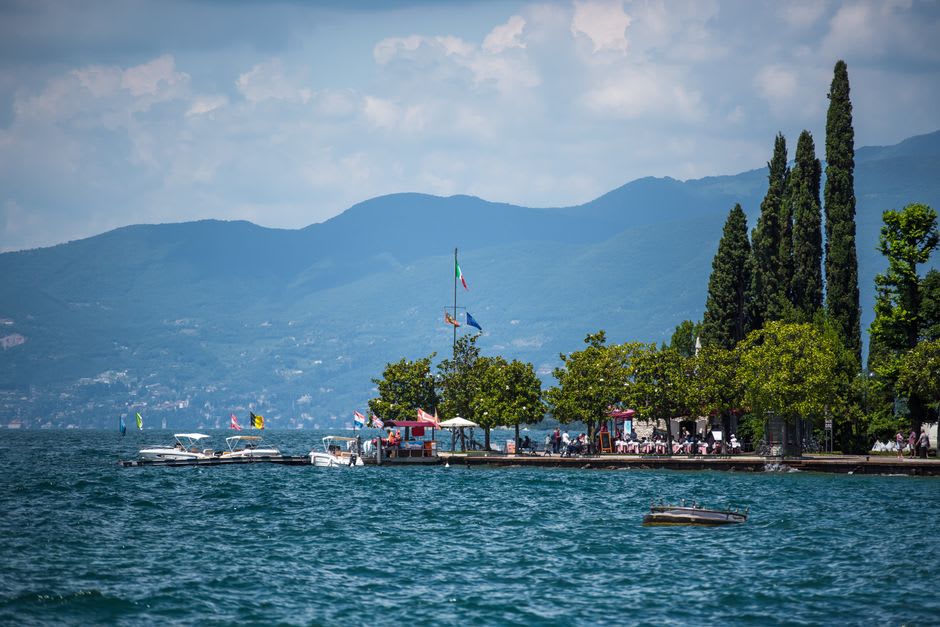 Traditional wooden lavorieri fish-trap structures standing in the still water of Lago di Varano at dawn