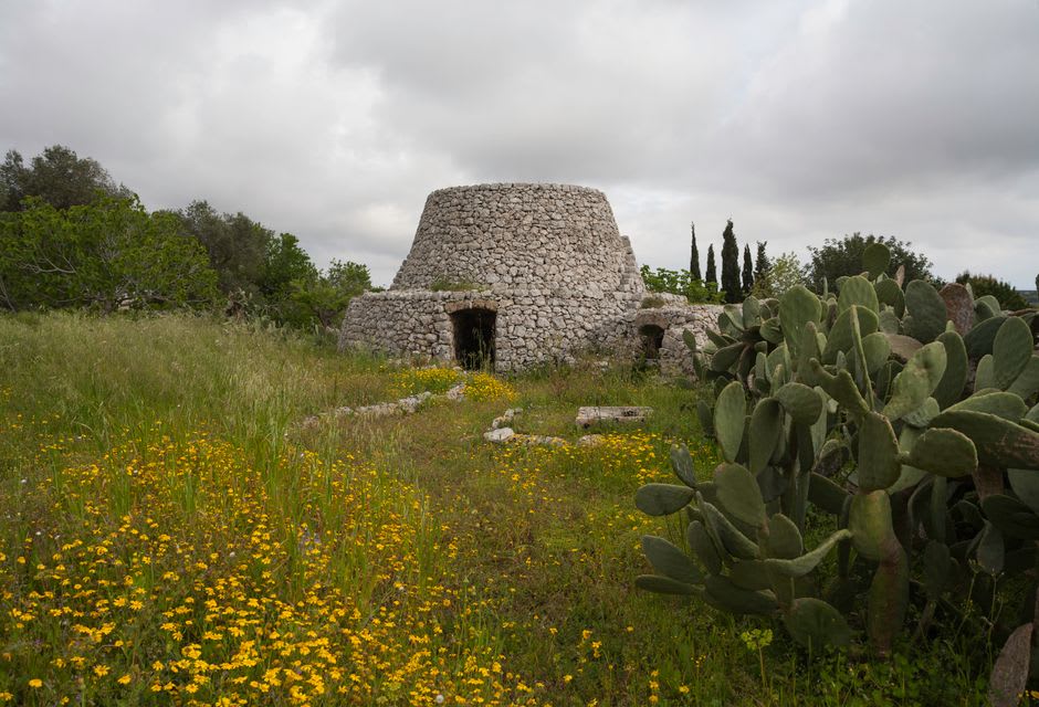 The Aragonese watchtower on its small islet connected by causeway at Torre Pali