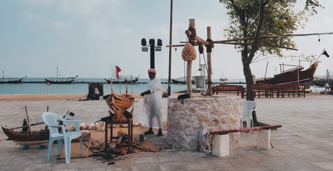The turquoise and cream tiled dome of Katara Mosque against the evening sky