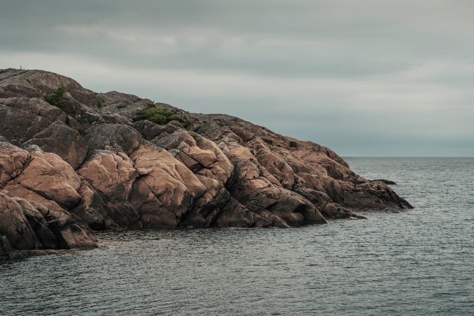 Mushroom-shaped limestone sea stacks in the Mingan Archipelago rising from the water at low tide