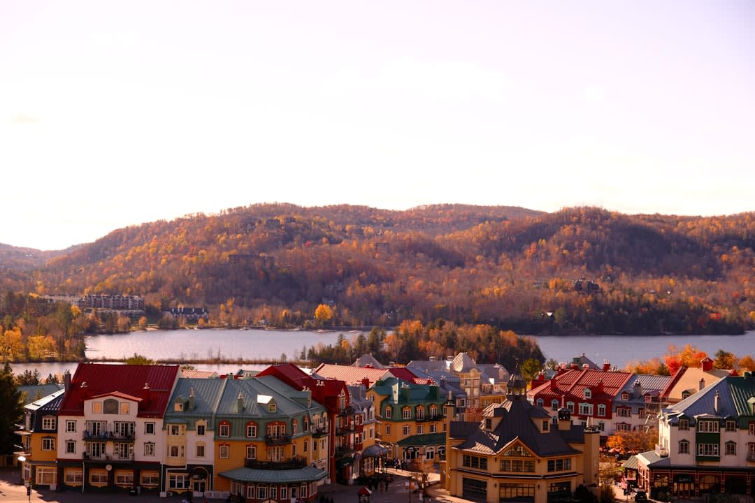 Le Village de Séraphin heritage buildings in Sainte-Adèle surrounded by autumn forest