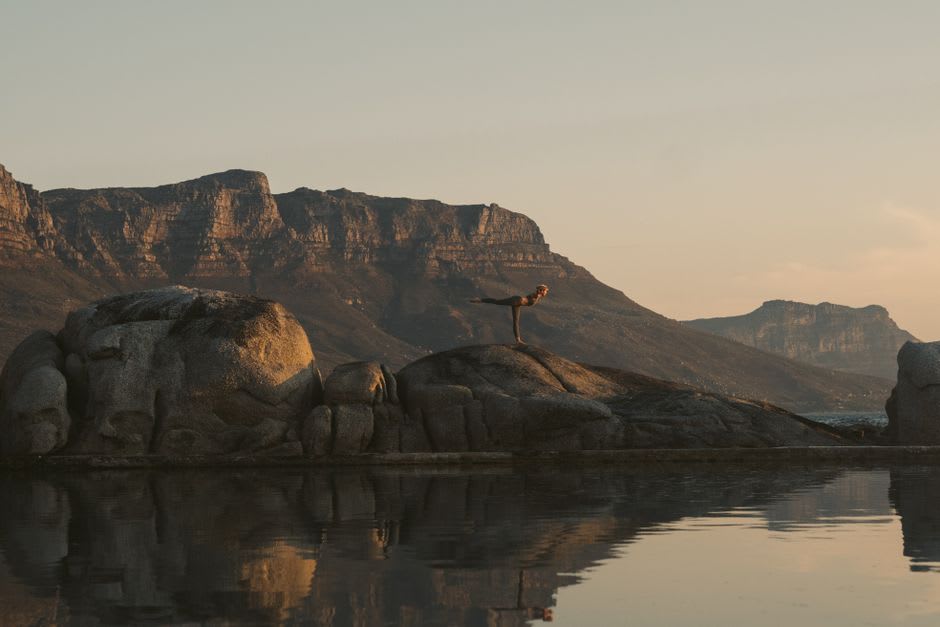 The famous balancing rocks of Girraween National Park, massive granite boulders stacked improbably against a blue sky