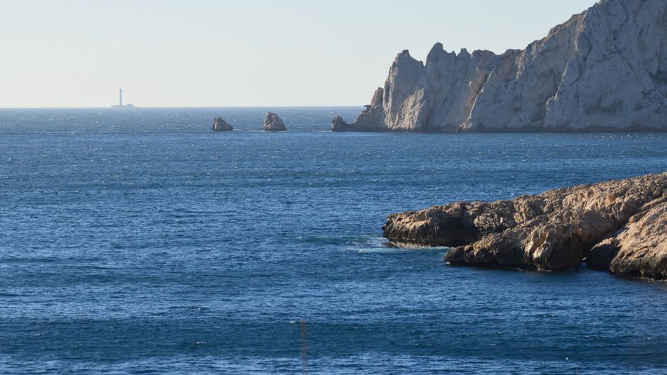 The lighthouse cliff at Ras Umm Sid with the reef wall visible in the clear water below