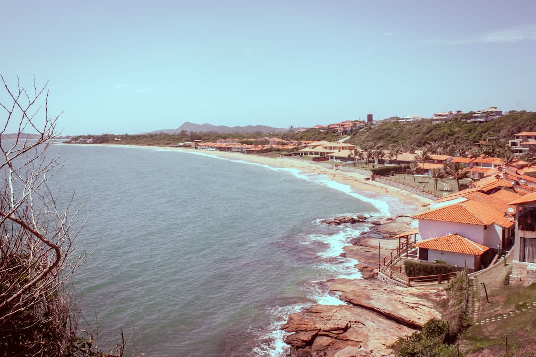 The historic lighthouse at Praia do Cassino standing against the coastal sky