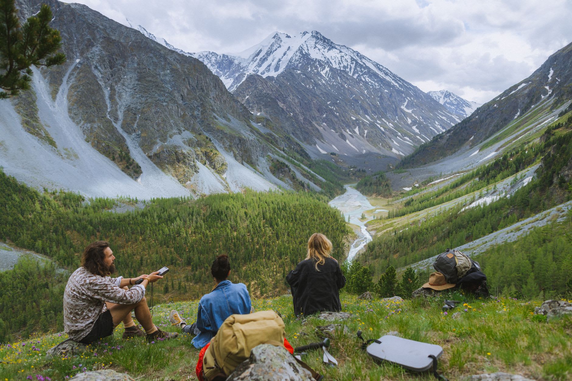 The Multinskiye Lakes in the Altai highlands — turquoise water surrounded by taiga forest and high peaks in summer